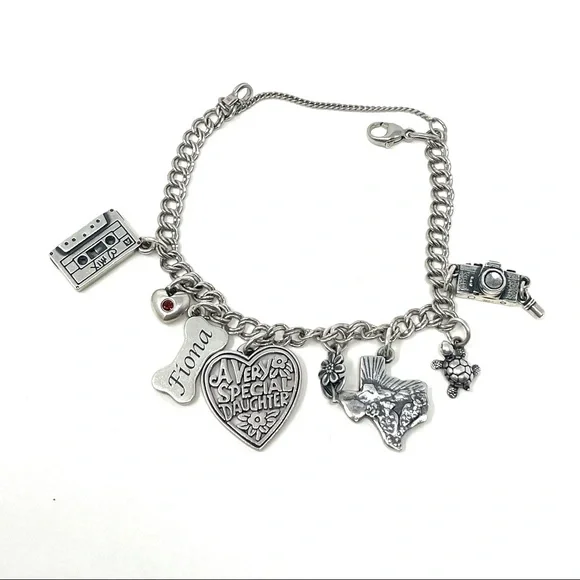 JAMES AVERY sterling silver charm bracelet, 8 charms Bracelets